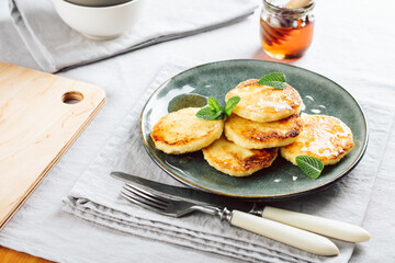 Cottage cheese pancakes with honey.