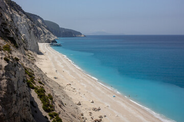 wonderful clear lefkas greece water and the egremni beach from above with some people swimming