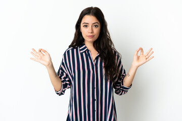 Young caucasian woman over isolated background in zen pose