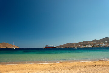 Fototapeta na wymiar Livadi beach with view over port on Serifos island in Greece