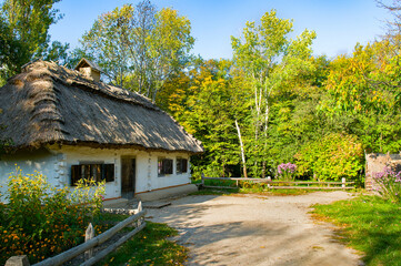 Fototapeta na wymiar Ancient Ukrainian huts in the National Museum of Folk Architecture and Life of Ukraine