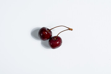 
cherries on a white background, hard light
