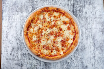 fresh pizza on the white plate