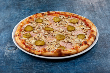 fresh pizza on the white plate
