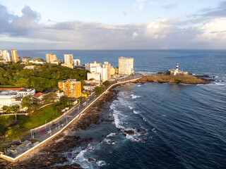 Fototapeta na wymiar Tip of Salvador with beautiful sunset lighting in a large coastal city with beach, Bahia, Brazil