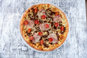 fresh pizza on the white plate