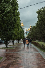 Rainy European street. Rainy weather in Kyiv on Mykhailivska Square