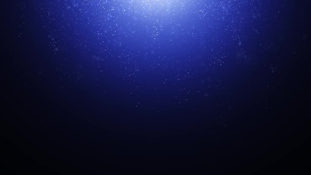 Looping dark blue glitter particles copy space background.