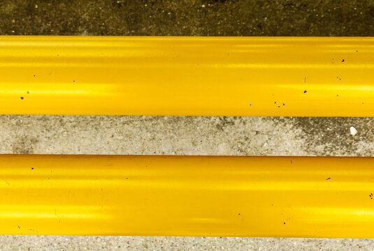 Top View Yellow Bench Detail In Bus Stop And Concrete Floor