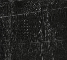 crumpled polyethylene on a black surface