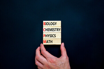 BCPM biology chemistry physics math symbol. Concept words BCPM biology chemistry physics math on wooden blocks on beautiful black background. Business BCPM biology chemistry physics math concept.