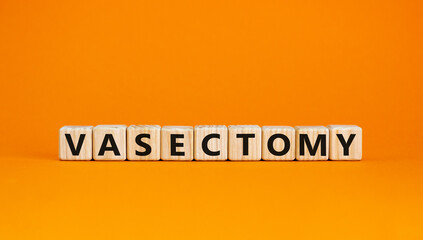 Vasectomy symbol. Concept words Vasectomy on wooden blocks. Beautiful orange table orange background. Medical and vasectomy problem concept. Conceptual image. Copy space.