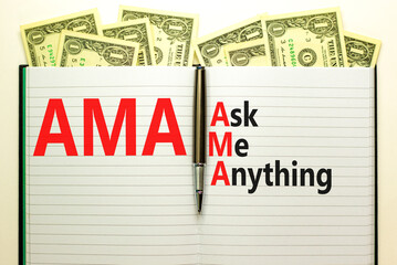 AMA ask me anything symbol. Concept words AMA ask me anything on white note on a beautiful white background. Dollar bills. Metallic pen. Business and AMA ask me anything concept. Copy space.