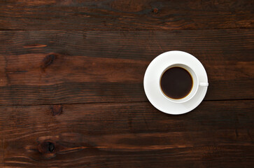 cup of coffee on wooden table