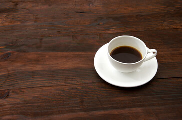 cup of coffee on wooden table