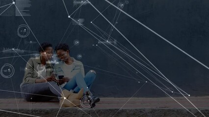 Animation of connections over happy african american twins women using smartphones - Powered by Adobe