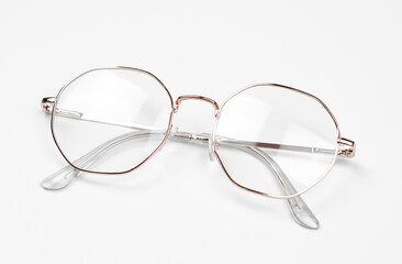 Stylish eyeglasses on a white background. Iron frame glasses