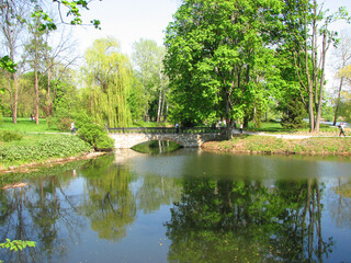 Fototapeta na wymiar Lake with brige in the Arboretum in park Alexandria, Belaya Tserkov, Ukraine 