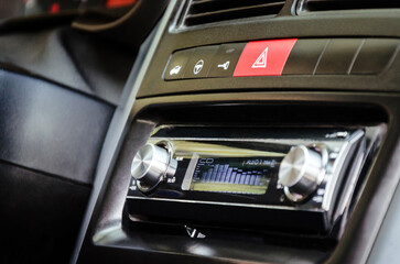 Old hi-fi car audio CD player in car`s dashboard. Closeup view