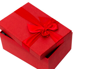 Red gift box with a bow. Isolated on а white background