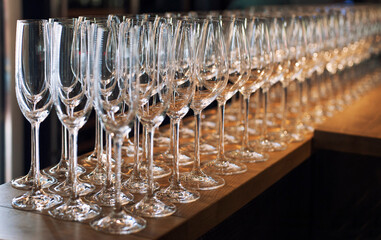 Clean glasses for drinks are on the bar in the restaurant