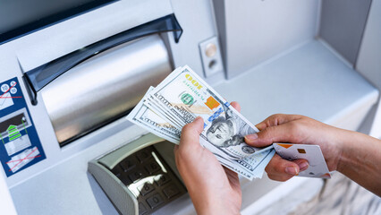 Atm machine money cash. Woman withdraw money bill. Holding american hundred dollar cash. Bank...