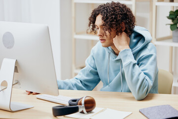 portrait of a man sitting in front of the computer internet online Lifestyle