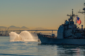 A warship returning from deployment into San Diego Harbor, California. © Acker