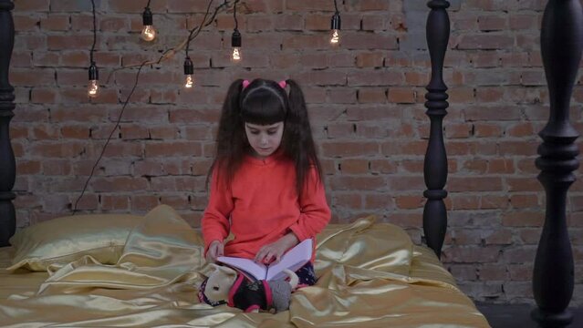  Small female child person reading, dreaming and imagination development