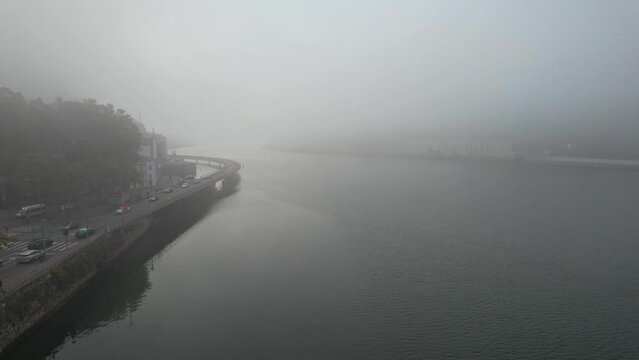 Porto Aerial Cityscape with road ower Douro River in Amazing Sea mist fog, Portugal