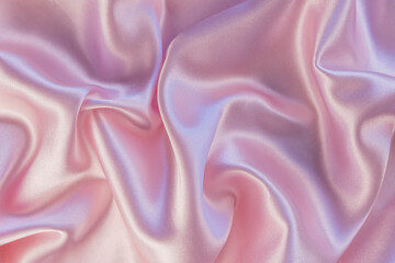 Luxury background design. Smooth texture of pink silk or satin. Can be used as wallpaper design, photo background.