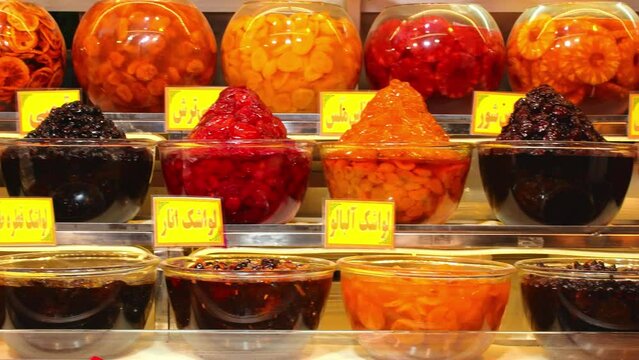 Piles of various colorful tasty candy sweets on bazaar for sale in iranian street market