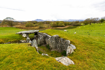 Fototapeta na wymiar Capel Garmon Burial Chamber with Welsh Mountains in Distance