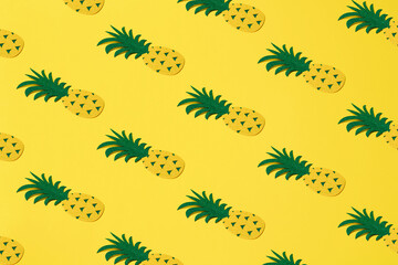 Felt pineapple on a yellow background. Pattern.