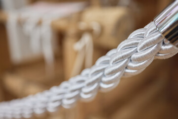 Nautical mooring line rope on the jetty. Curled mooring line.