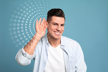 Handsome man and sound illustration on light blue background. Hearing concept
