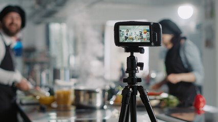Professional camera filming culinary class on online cooking show, using vlog content for...