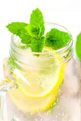 Lemon mint water with ice.Citrus cocktail with mint leaves. Sassy lemon water.Lemon summer drink.