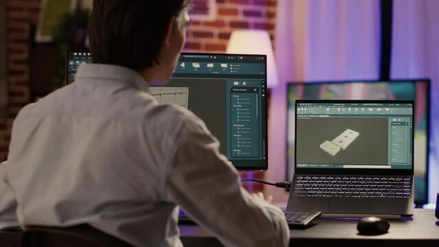 Advanced product construction on industrial software with computer and laptop, using creative manufactory blueprint. Developing engine component design with machinery construction.