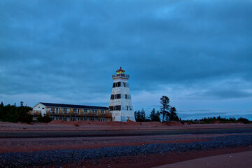 striped lighthouse on the beach