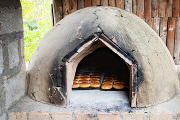 The home oven with just baked buns in it. Traditionally used in villages. Ecuador. Azuay province,...
