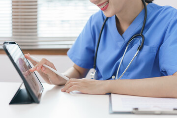 Pet care concept, Female veterinary using tablet for relaxation after examining health pet.