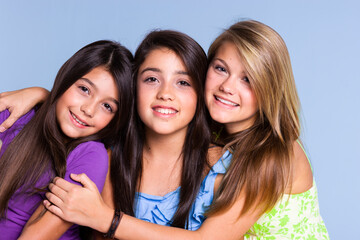 Portrait of three young girls in a studio
