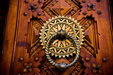 Details of old wooden door with carved elements, old architecture