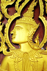 Decorative of wood carving on the door in Thai temple