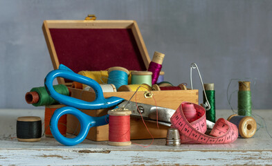 Still life with sewing accessories and a box. Vintage.