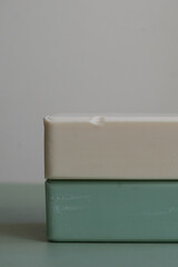 two bars of soap: white and mint