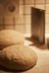 The process of making wheat bread at home. Dough shaping. The concept of healthy homemade food. Vertical photo.