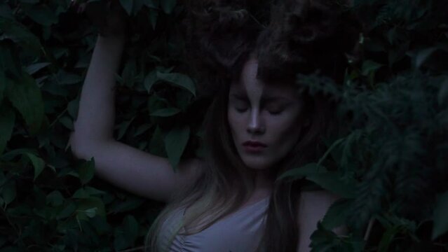 Slow Motion shooting cosplay girl elf in the forest