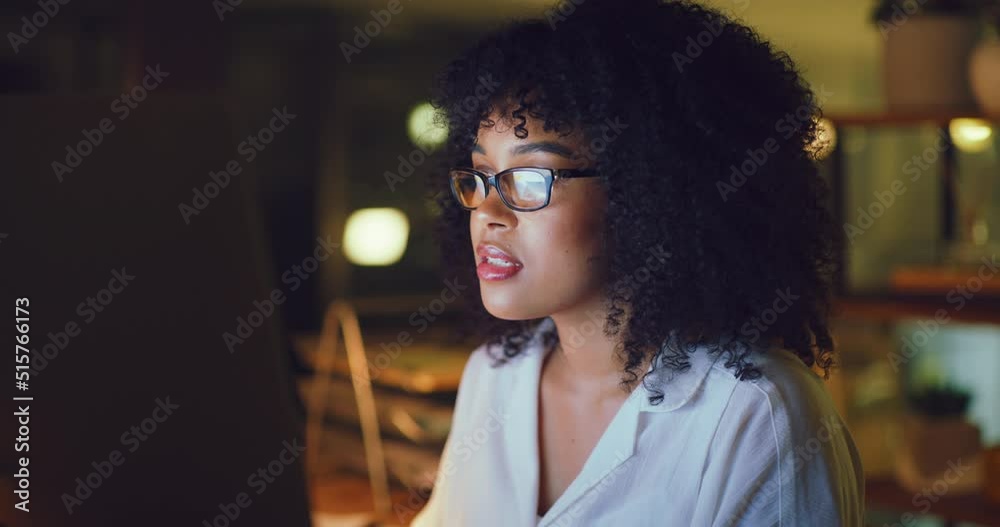 Poster young business woman checking and sending emails online on a desktop computer while working late in 